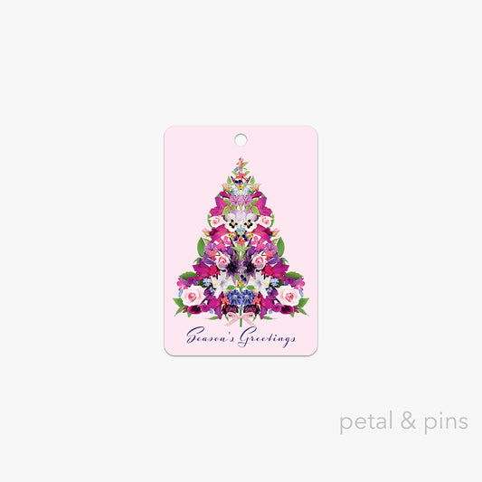 cottage garden Christmas tree gift tag by petal & pins featuring a floral Christmas tree design on a pink background with 'Season's Greetings' text.