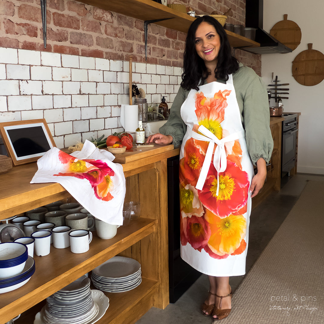 poppy apron by petal & pins - styled on model in kitchen