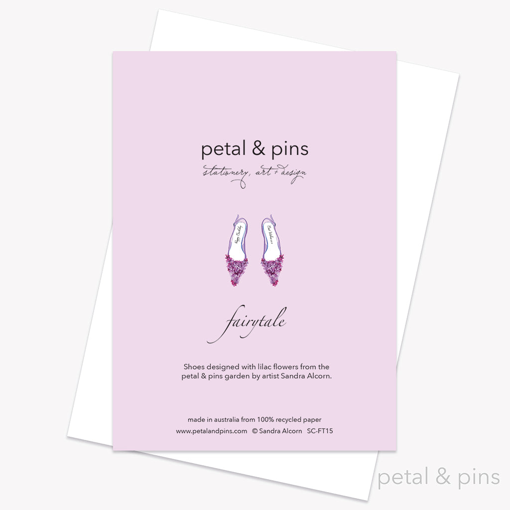 Greeting card back with floral high heels and 'Happy Birthday' text on a lilac background by petal & pins.